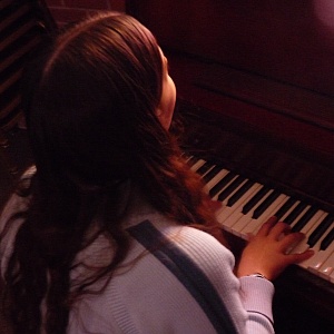 Mary playing piano